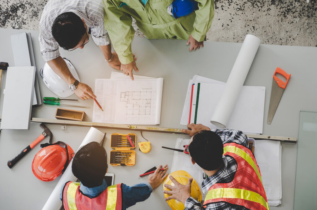 Top View Of Group Of Engineer, Technician And Architect Planning